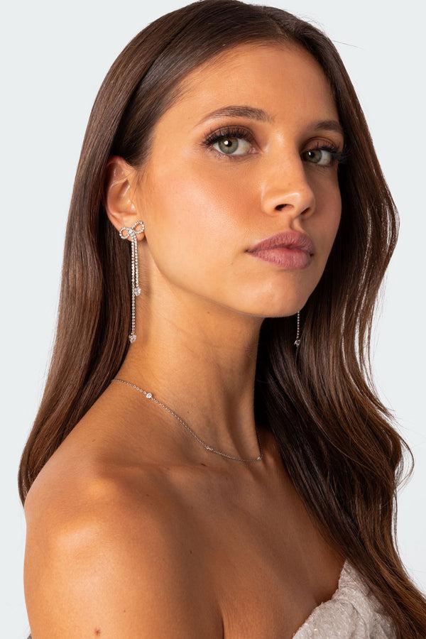 edikted Rhinestone Dangling Bow Earrings silver